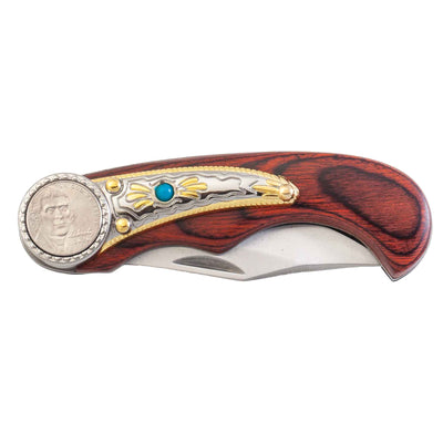 pocket knife of wood handle and turquoise accent including a decorative nickel