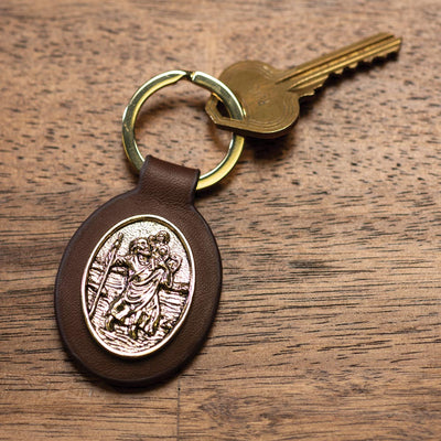 Brown leather keychain with St. Christopher scene token